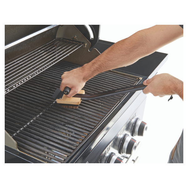Gas grill brush outlet